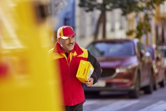 DHL courier delivering a shipment