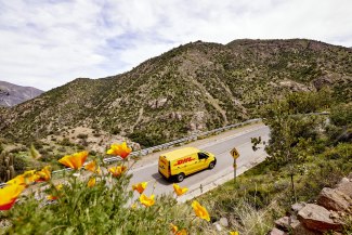 DHL van driving on a street in the Anden mountains